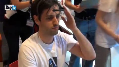 Participant using the Neuro Ski headset at a public event